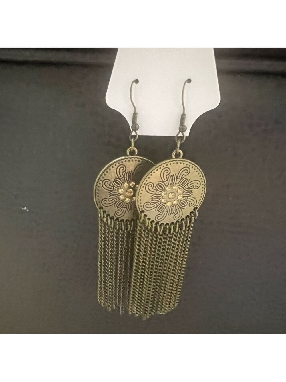 FASHION JEWELRY copper in color with copper colored stones and tassels.